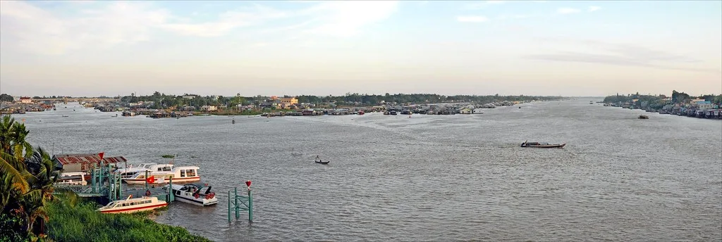 Wide view across the Bassac River at Chau Doc on the route from Can Tho