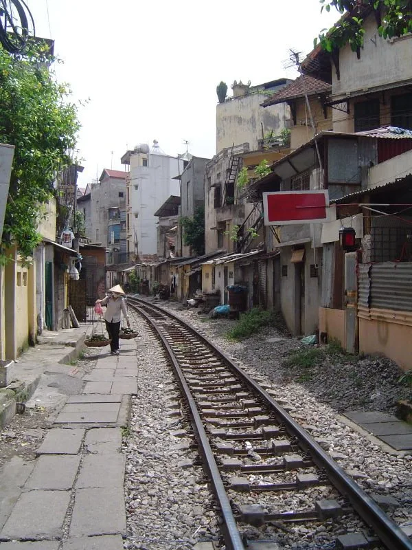 Railway tracks running between homes and cafes on Hanoi Train Street
