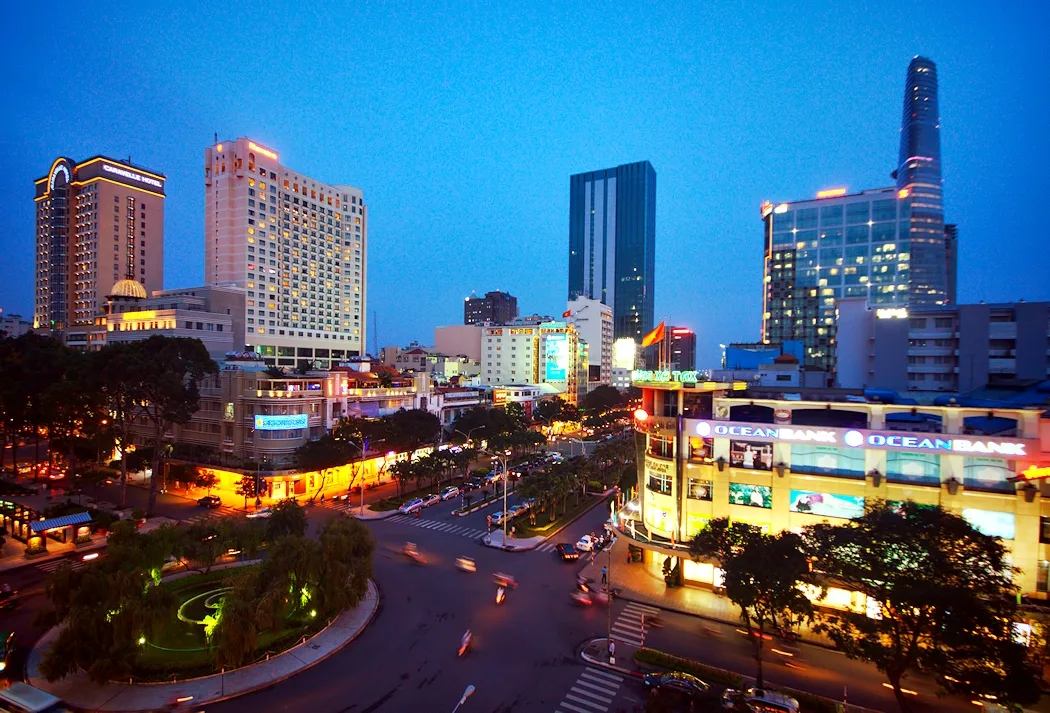 Illuminated Ho Chi Minh City towers and streets after nightfall