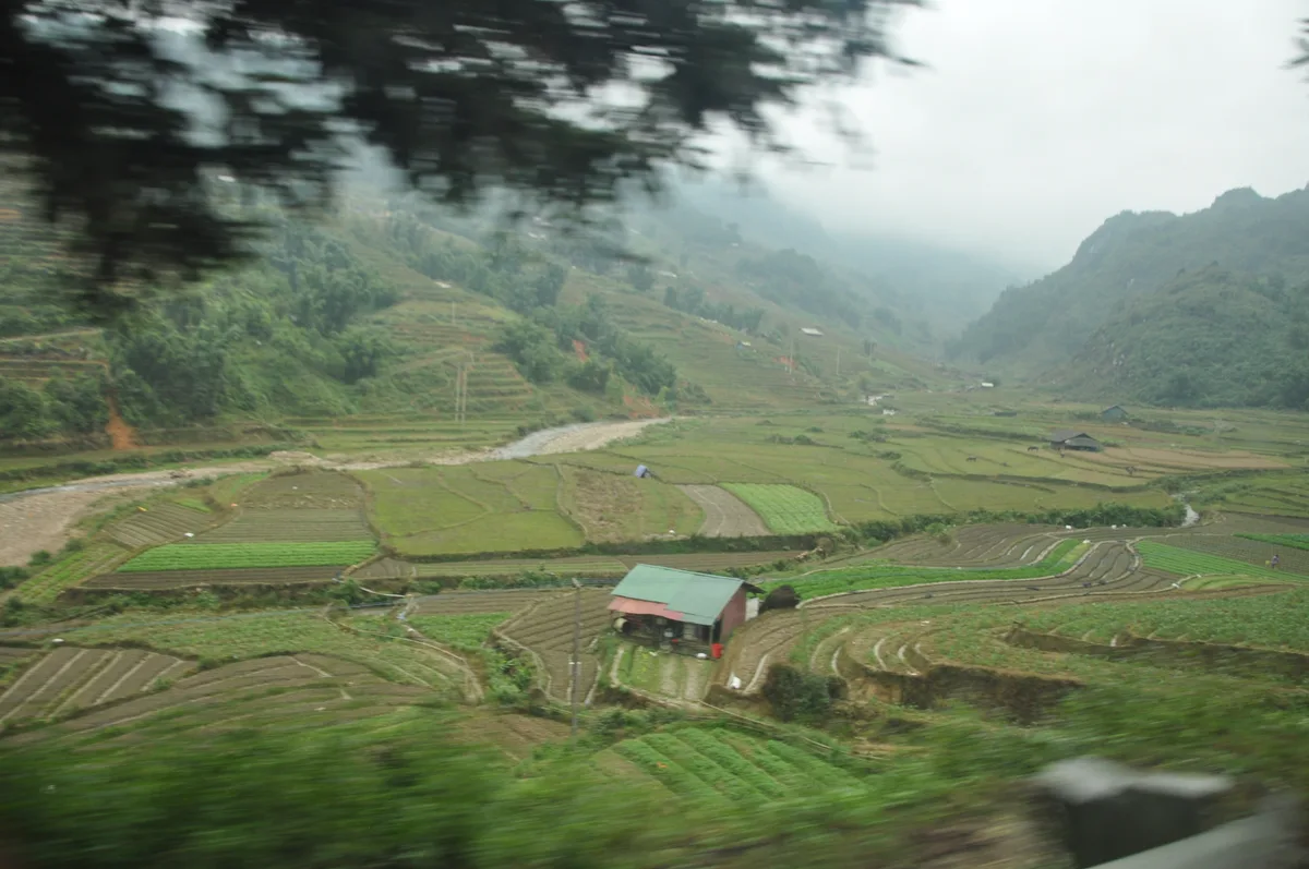 Mountain valleys of northern Vietnam viewed from a moving train