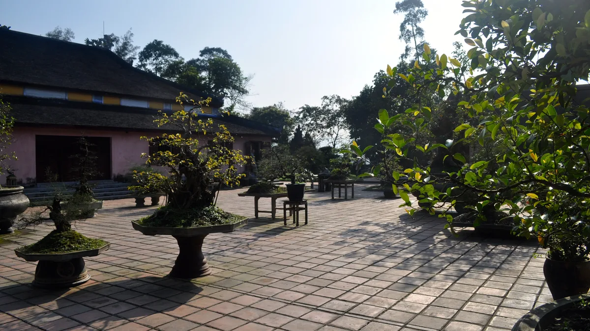 Visitors approaching Thien Mu Temple during a day of sightseeing in Hue