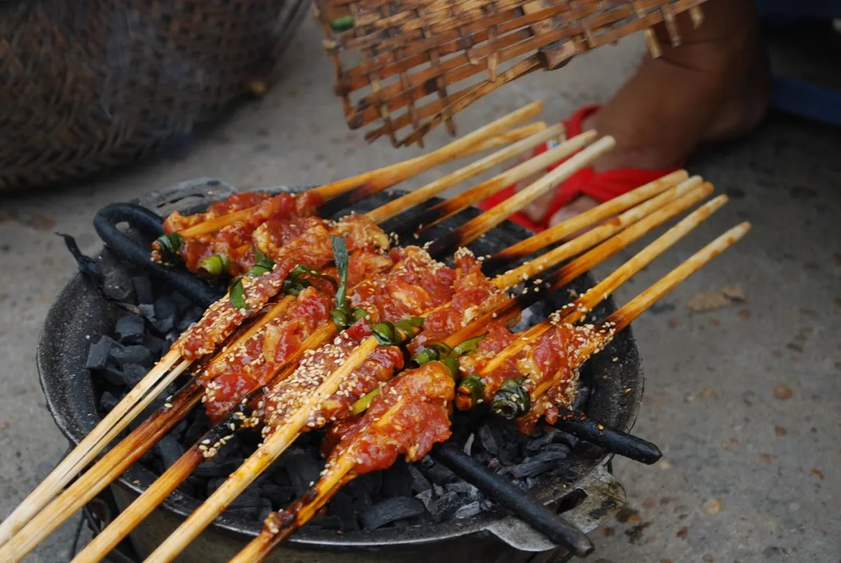 Grilled Pork Skewers (Thit Xien Nuong) in Vietnam, contextual view for travelers planning a trip in Vietnam
